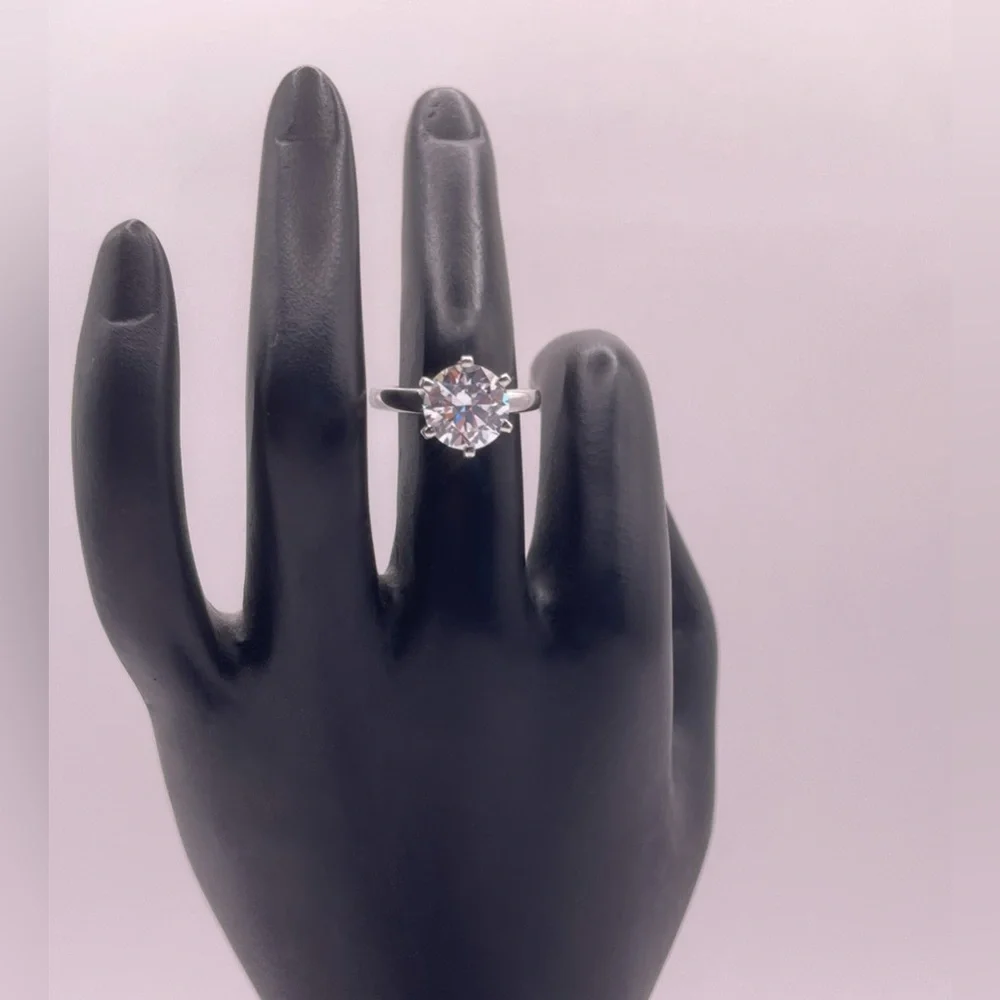 Two (2) carat cz solitaire in a 925 sterling silver setting. Size 6.25.